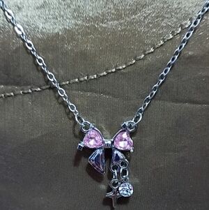 Charming Pink Bow Necklace with Dangling Charms